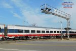 Four Siemens coaches sandwiched between a pair of Chargers